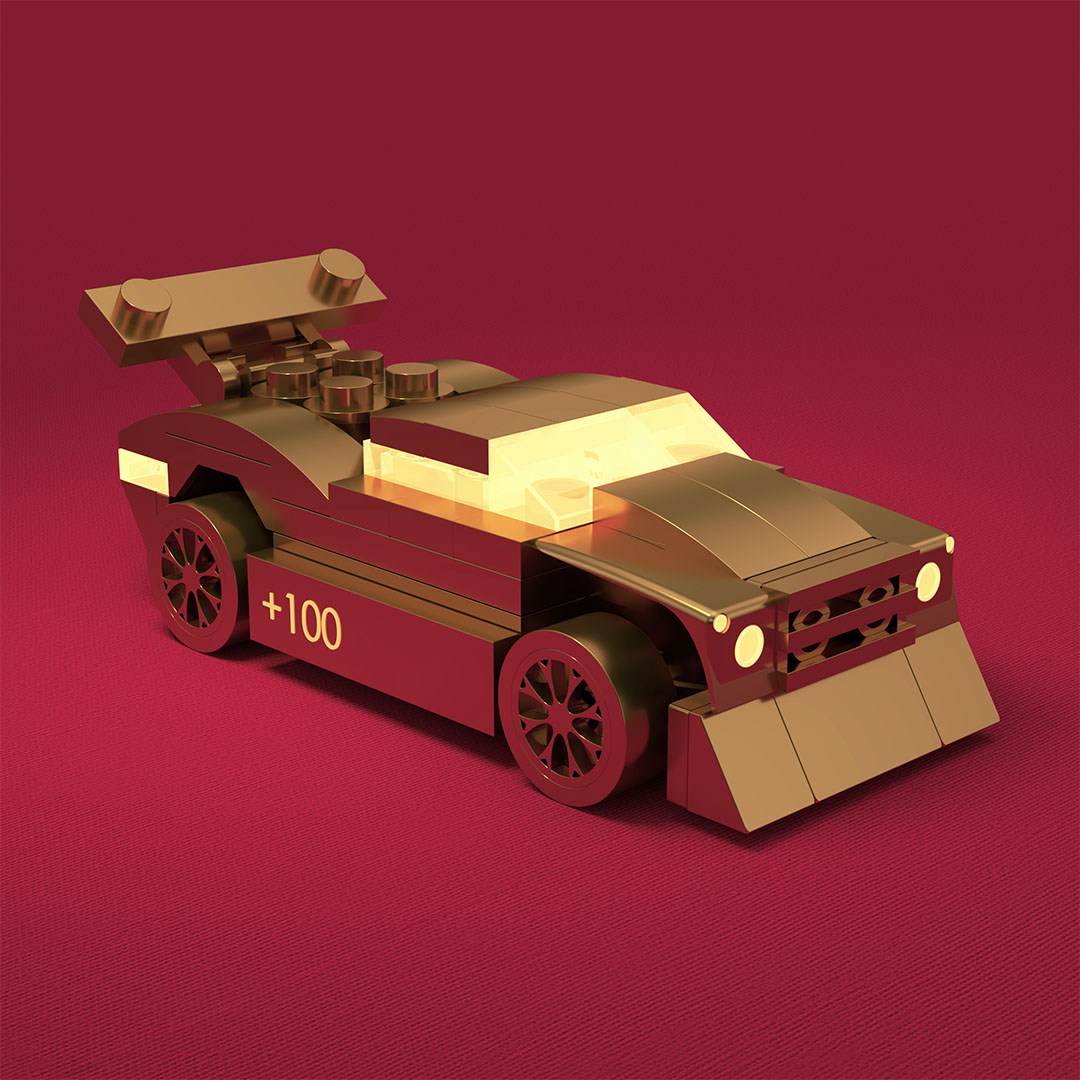Car model in gold on a red backdrop
